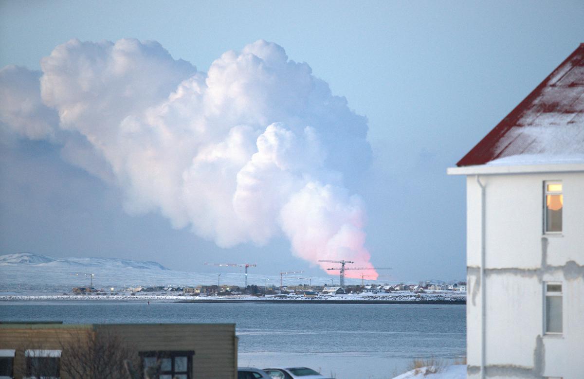 A volcanic eruption is seen in the distance from the Icelandic capital of Reykjavik, Iceland, February 8, 2024. 