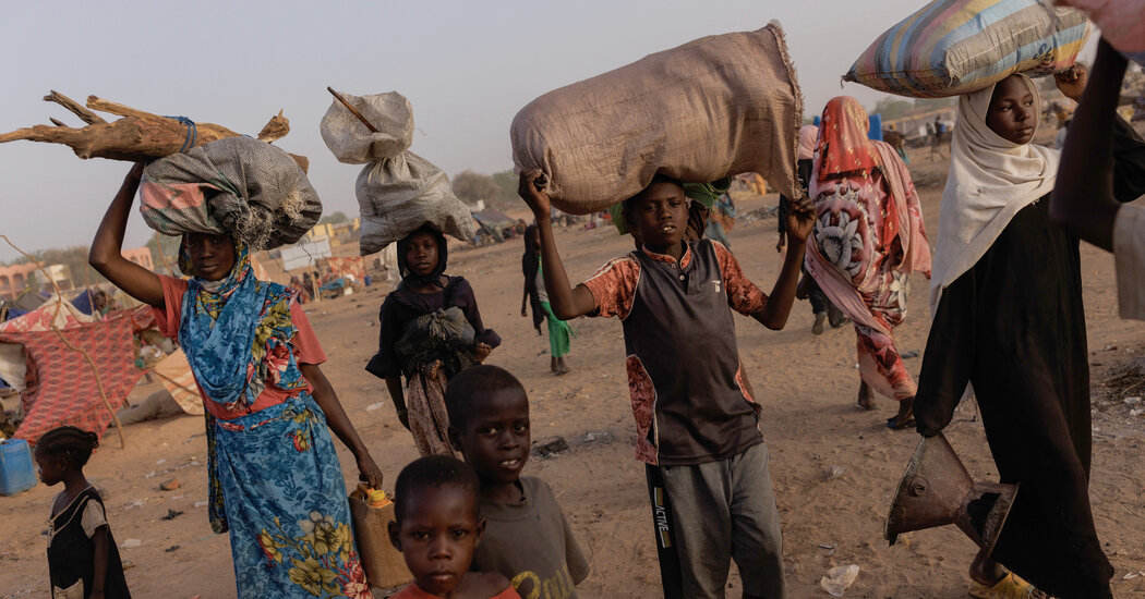 Surrounded By Fighters And Haunted By Famine Sudan City Fears.jpg